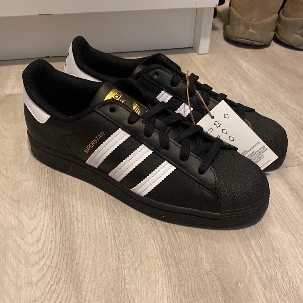 Black adidas shell toes